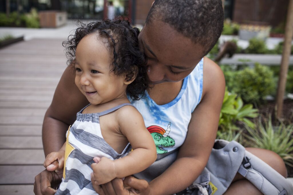 Woman holding a young girl