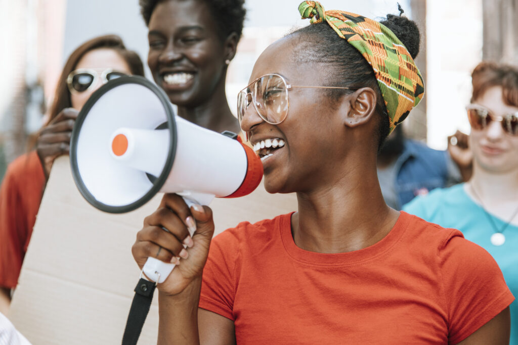 Woman holding a megaphone at a rally