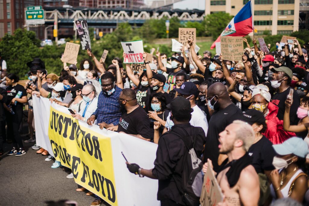 Group of people marching in a protest